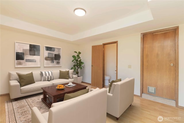 34126 30th Ave SW, Federal Way, WA 98023 - living room with a tray ceiling, light wood-style floors, and baseboards