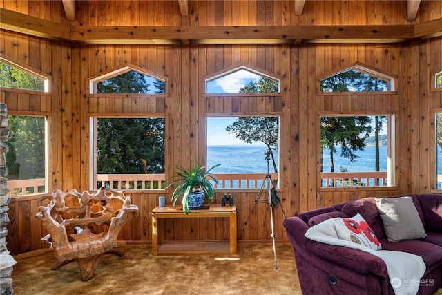 sunroom / solarium with a water view