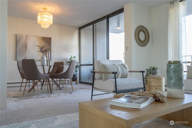 carpeted living room with a chandelier and a wall of windows