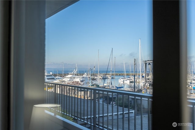 balcony featuring a water view