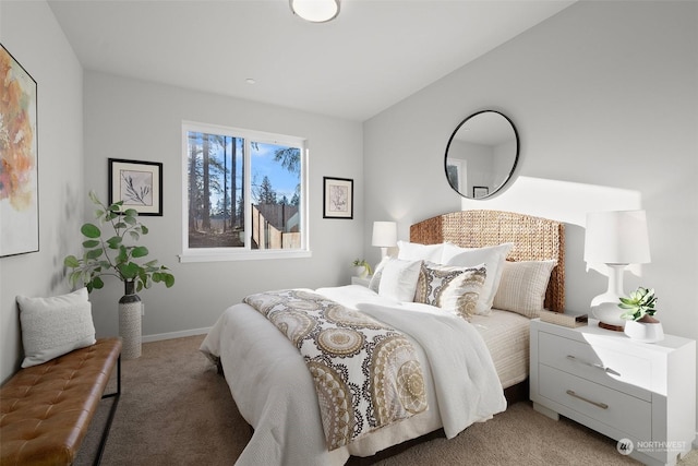 bedroom featuring lofted ceiling and light colored carpet