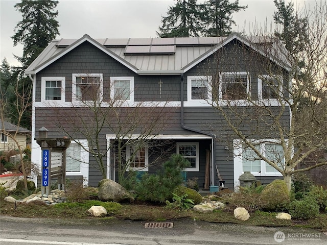 craftsman-style house with metal roof and a standing seam roof