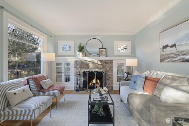 living room with a fireplace and light hardwood / wood-style floors