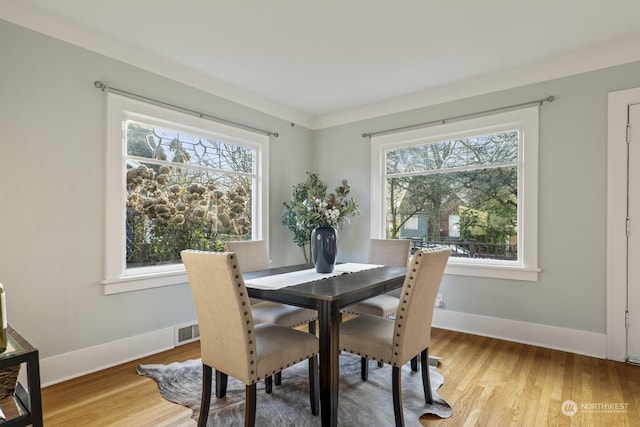 dining room with hardwood / wood-style floors