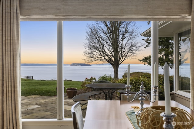 sunroom with a water view