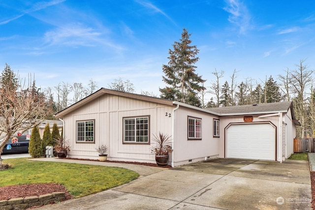 view of front facade featuring a garage and a front lawn