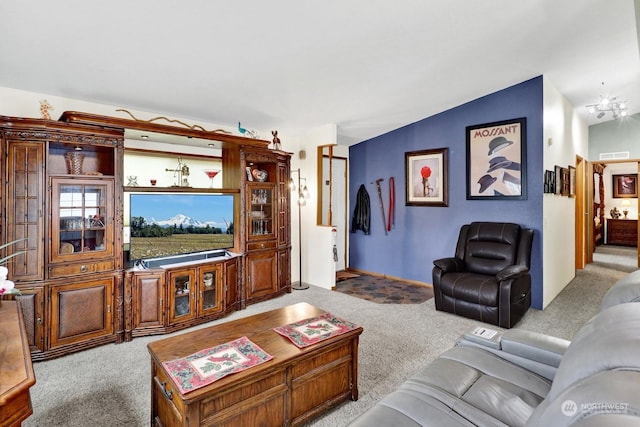 living room featuring an inviting chandelier and light colored carpet