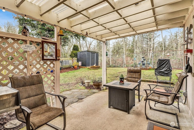 view of patio with a pergola and a shed