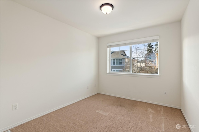 unfurnished room featuring carpet flooring