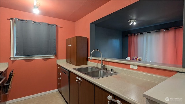 kitchen featuring black dishwasher and sink