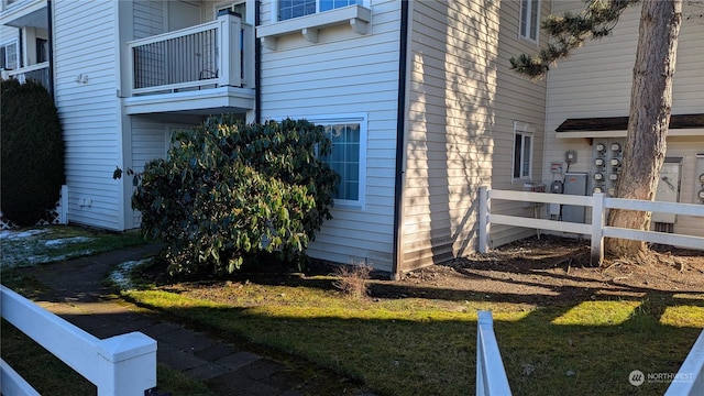 view of home's exterior with a balcony