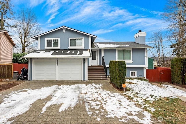 split level home featuring a garage