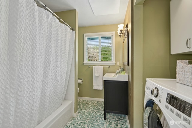 bathroom featuring shower / bath combination with curtain, vanity, and washer / dryer