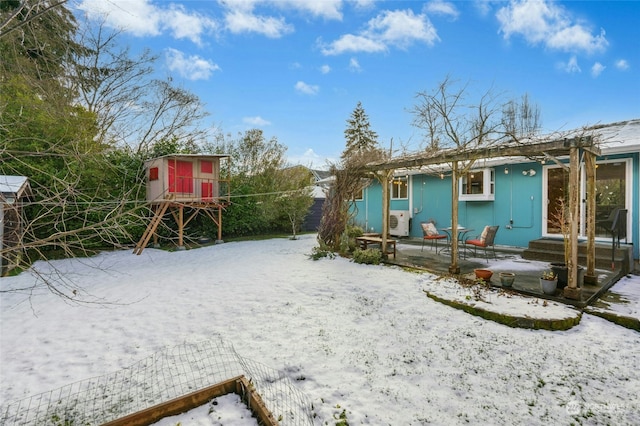 yard covered in snow featuring a shed