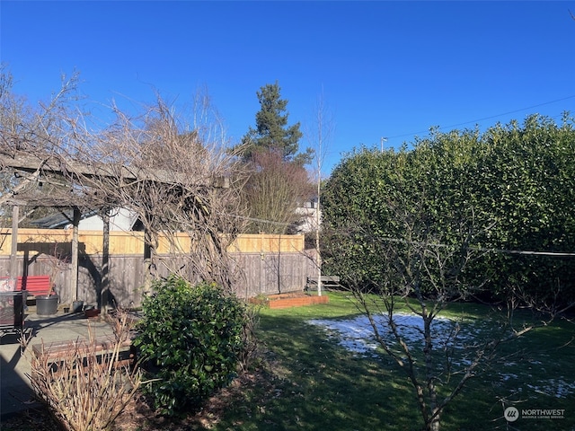 view of yard featuring a water view and a patio area