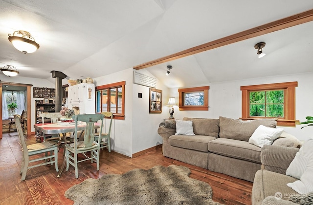 living room featuring hardwood / wood-style flooring and vaulted ceiling