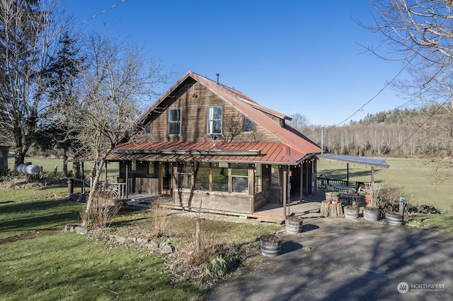 view of front of house with a front lawn and a patio area