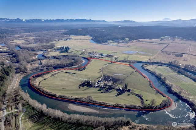 aerial view with a water and mountain view and a rural view