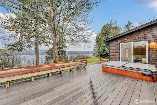 wooden terrace with a covered hot tub