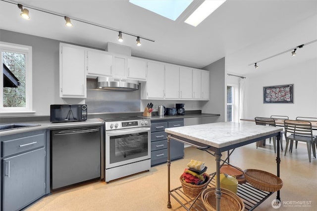 kitchen with electric stove, wall chimney exhaust hood, white cabinetry, black microwave, and dishwashing machine