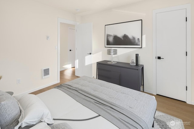 bedroom featuring light wood-type flooring