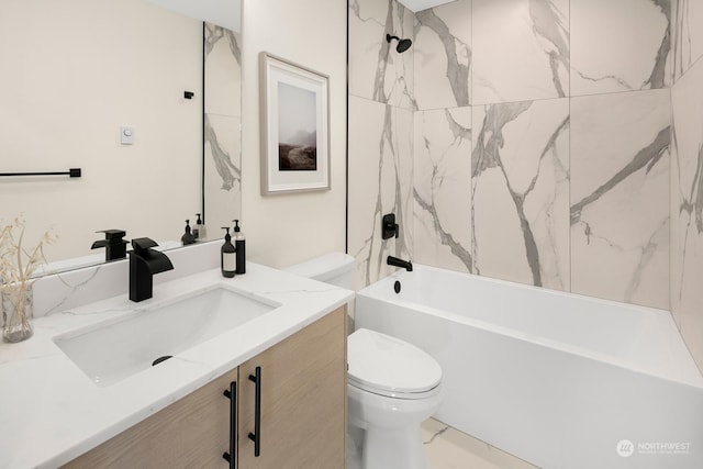 full bathroom with vanity, toilet, and tiled shower / bath