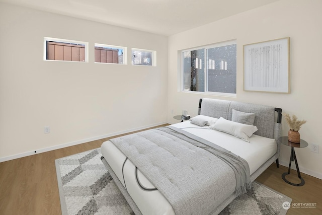 bedroom with hardwood / wood-style flooring