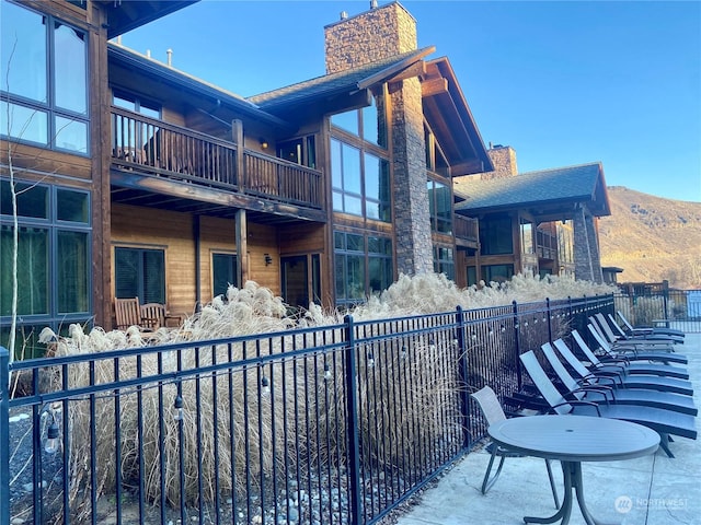 view of property exterior featuring a mountain view