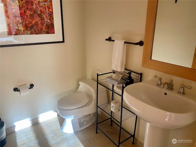 bathroom featuring sink and toilet