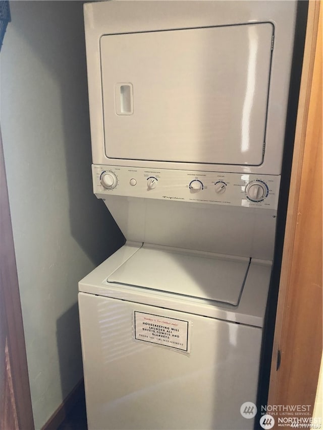 laundry room featuring stacked washer and dryer