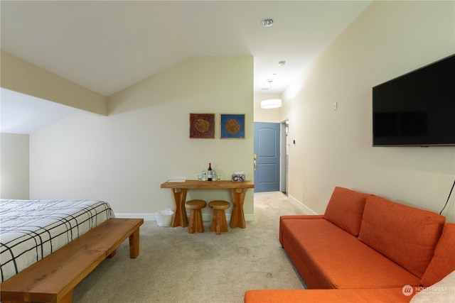 carpeted bedroom with vaulted ceiling