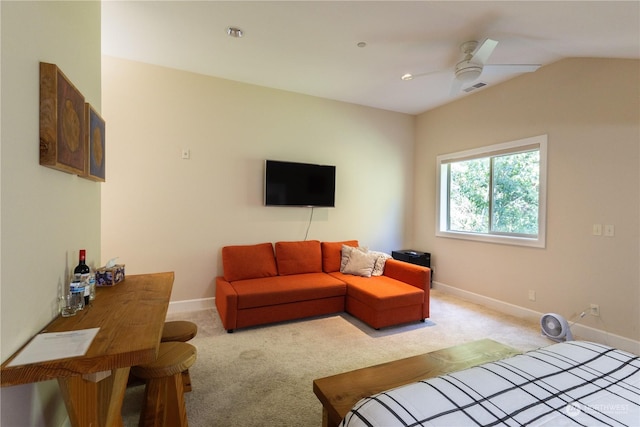 carpeted living room with vaulted ceiling and ceiling fan