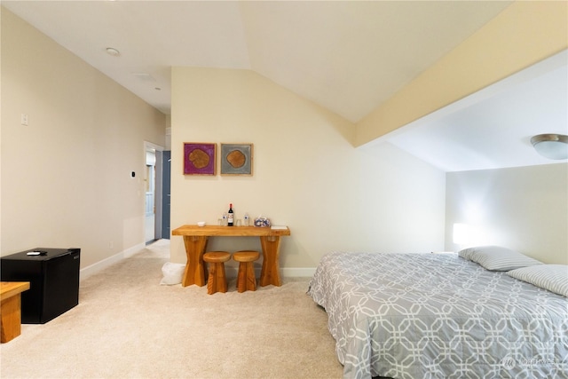 carpeted bedroom featuring vaulted ceiling with beams