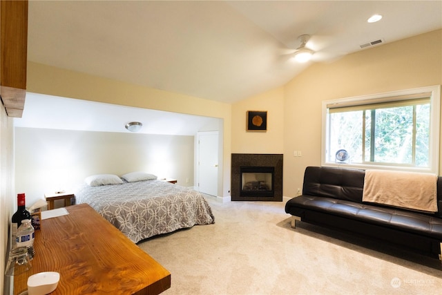 carpeted bedroom featuring lofted ceiling and ceiling fan