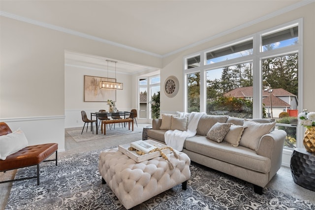 living room with ornamental molding and carpet floors