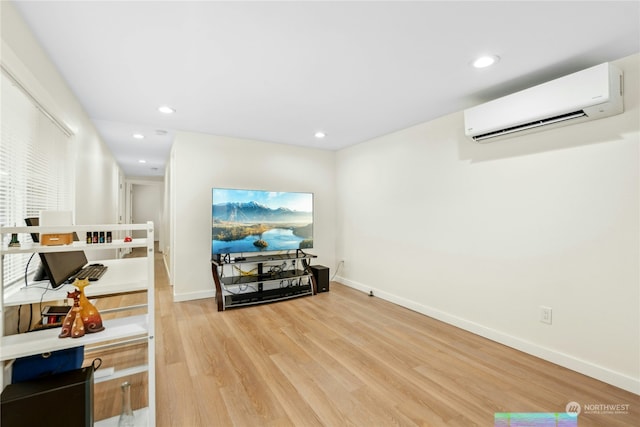 interior space featuring a wall unit AC and light hardwood / wood-style floors