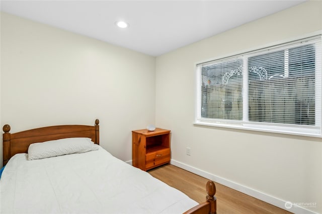 bedroom featuring hardwood / wood-style flooring