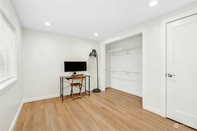 interior space featuring hardwood / wood-style flooring and a closet