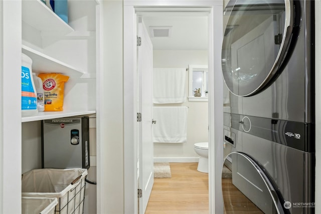 bathroom with hardwood / wood-style flooring and toilet