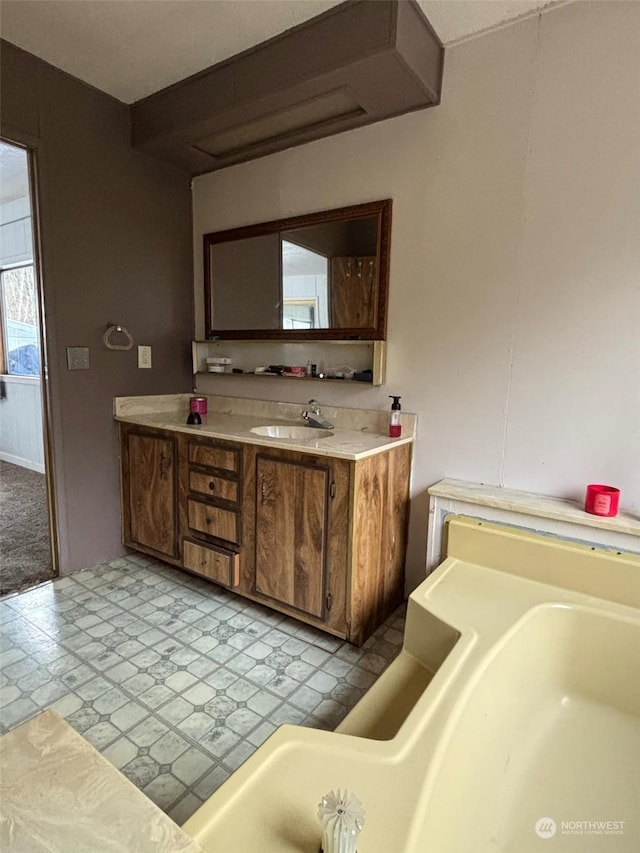 bathroom featuring vanity and a tub