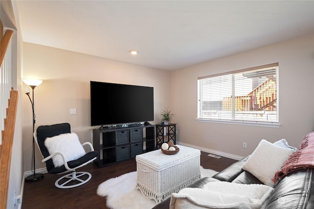 living room featuring dark hardwood / wood-style flooring