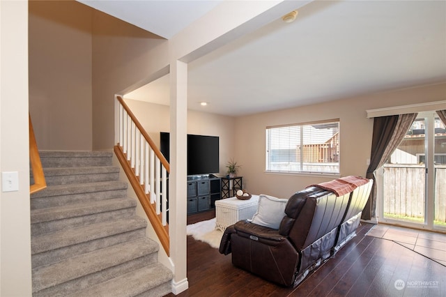 living room featuring dark wood-type flooring