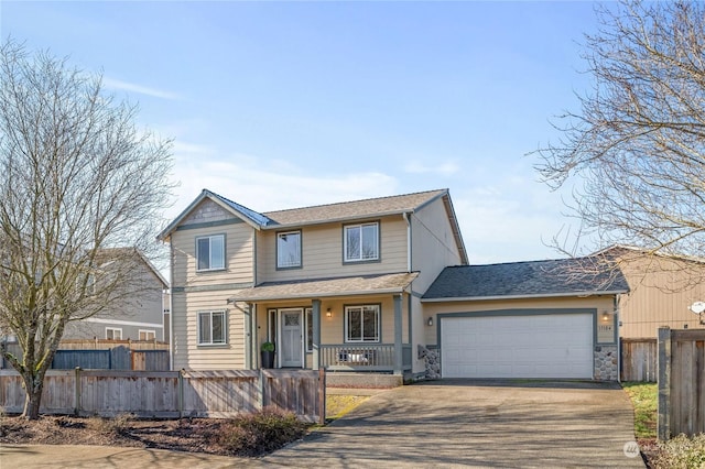 front of property with a porch and a garage