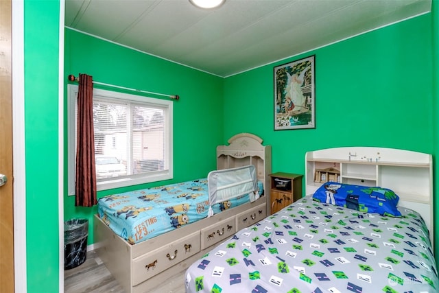 bedroom featuring wood-type flooring