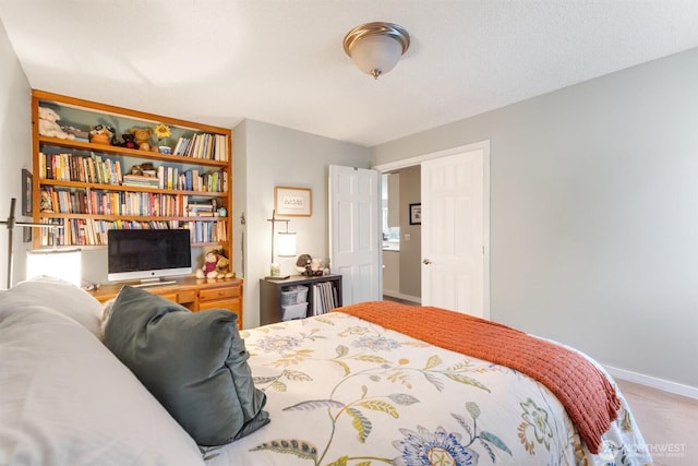 bedroom featuring baseboards