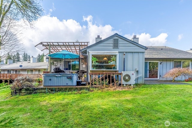 rear view of house featuring ac unit, a yard, board and batten siding, a chimney, and a hot tub