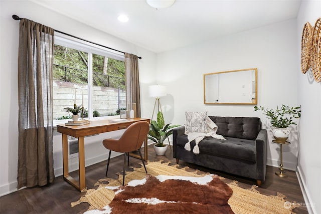 home office with dark hardwood / wood-style flooring