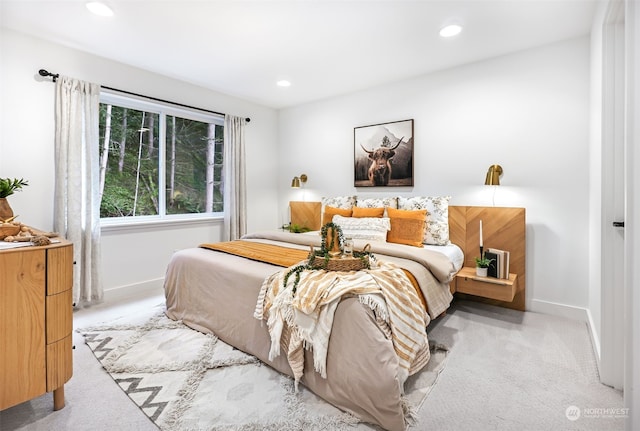 bedroom with light colored carpet