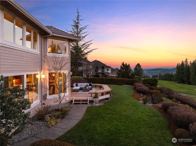 yard at dusk with outdoor lounge area