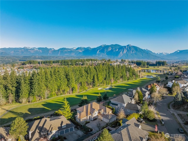 birds eye view of property with a mountain view